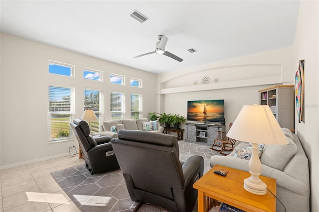 tiled living room with ceiling fan