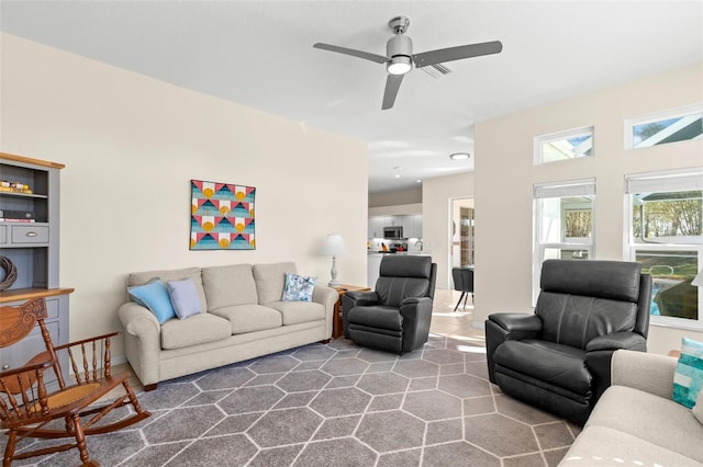 living room featuring ceiling fan