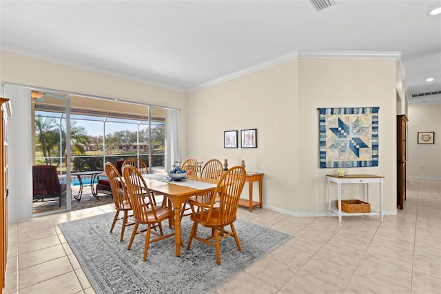 dining space featuring light tile patterned floors and ornamental molding