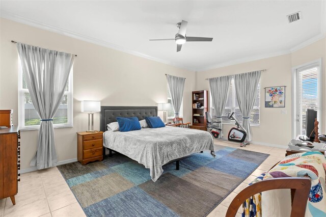 tiled bedroom featuring multiple windows, ceiling fan, and ornamental molding