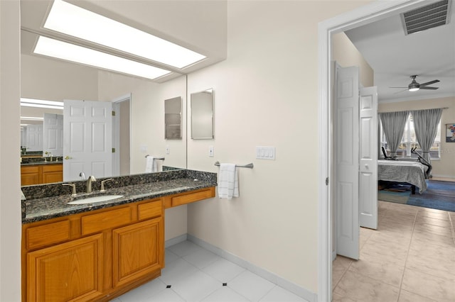 bathroom featuring vanity, ceiling fan, and crown molding