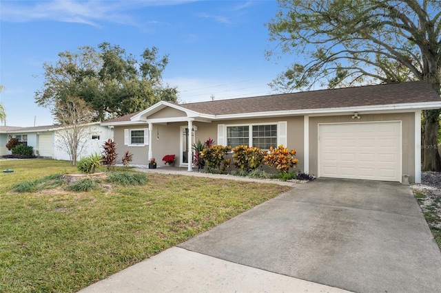 single story home featuring a front lawn and a garage