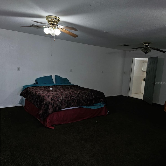 bedroom featuring ceiling fan, carpet, and a textured ceiling