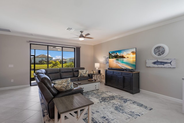 living room featuring ceiling fan, light tile patterned floors, and crown molding