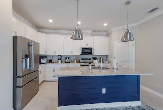 kitchen with an island with sink, sink, white cabinets, and stainless steel appliances