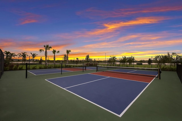 view of tennis court featuring basketball court