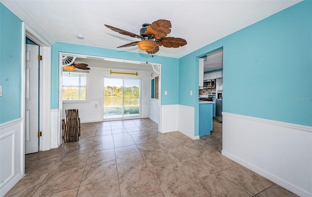 interior space featuring light tile patterned floors and ceiling fan