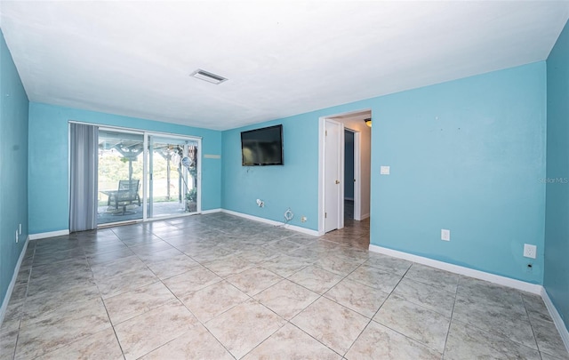 view of tiled spare room