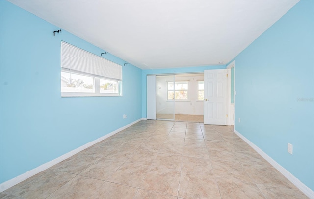 spare room with light tile patterned floors