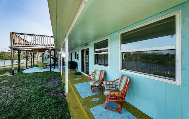 exterior space featuring a deck and a patio area