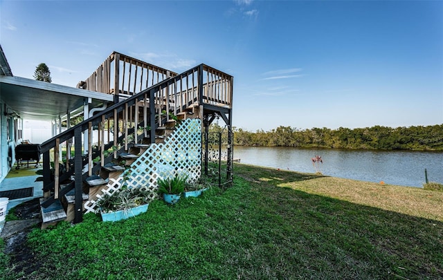 exterior space with a yard and a water view