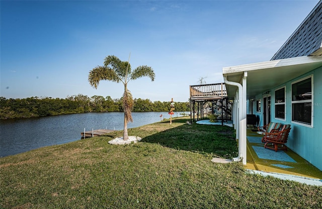 view of yard featuring a deck with water view