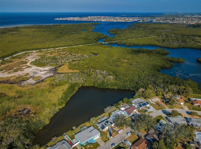 drone / aerial view with a water view