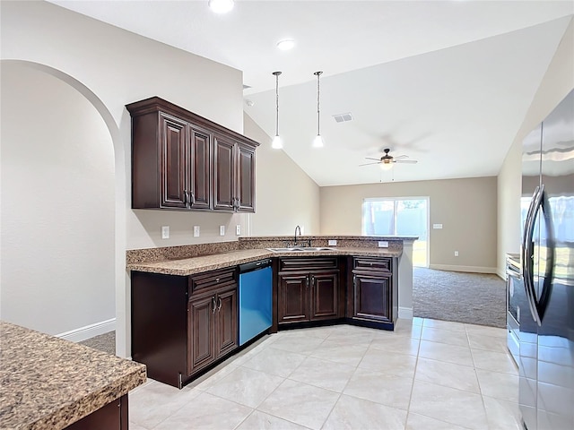 kitchen with dark brown cabinets, stainless steel appliances, ceiling fan, and lofted ceiling