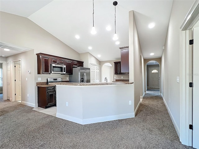 kitchen featuring pendant lighting, sink, vaulted ceiling, light colored carpet, and stainless steel appliances