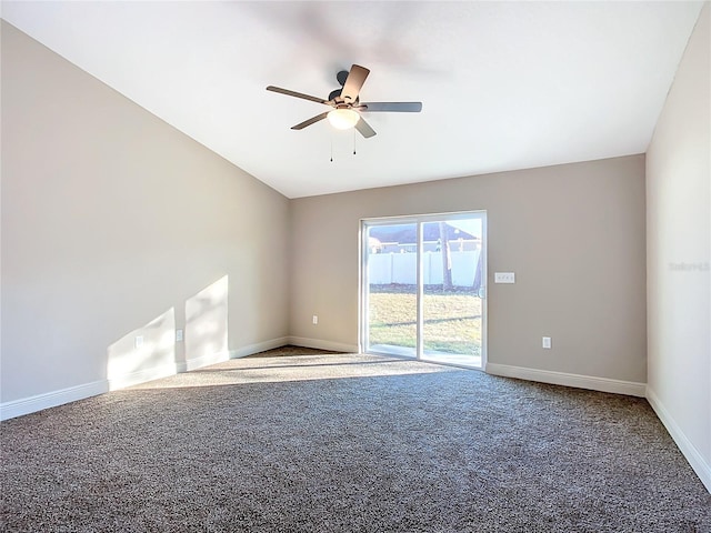 spare room featuring carpet, ceiling fan, and lofted ceiling