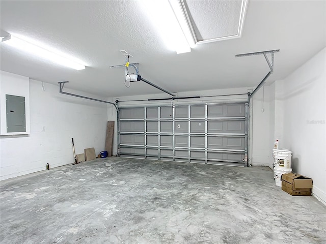 garage featuring electric panel and a garage door opener