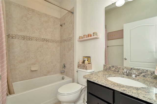 full bathroom with shower / bath combo, vanity, and toilet