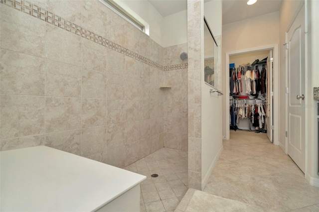 bathroom with tiled shower