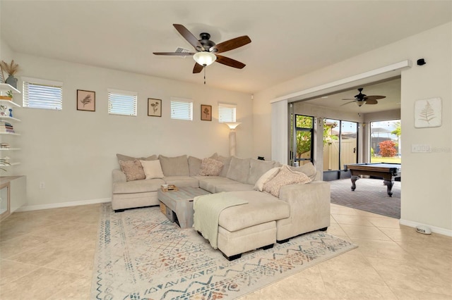 living room with ceiling fan, light tile patterned floors, and pool table