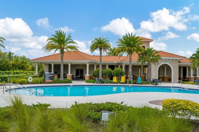 view of swimming pool with a patio