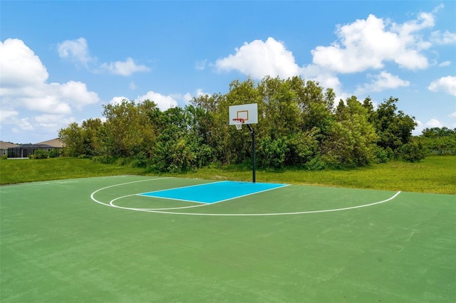 view of sport court featuring a yard