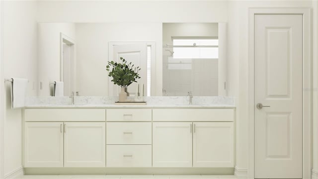 bathroom featuring a shower and vanity