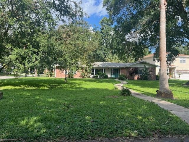 view of front of home with a front yard