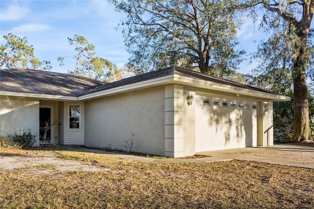 view of property exterior featuring a garage