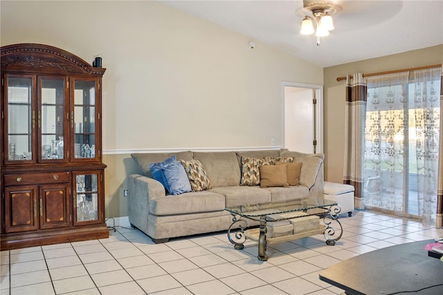 tiled living room featuring ceiling fan and lofted ceiling