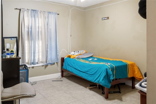 bedroom featuring light tile patterned floors