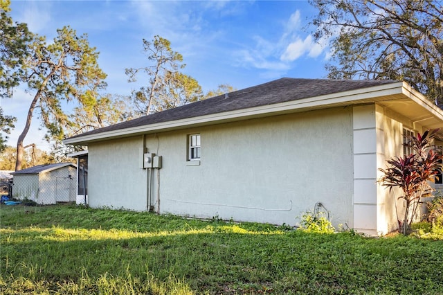 view of property exterior with a yard