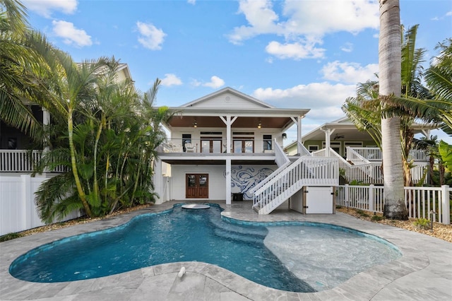 view of pool with ceiling fan, an in ground hot tub, and a patio