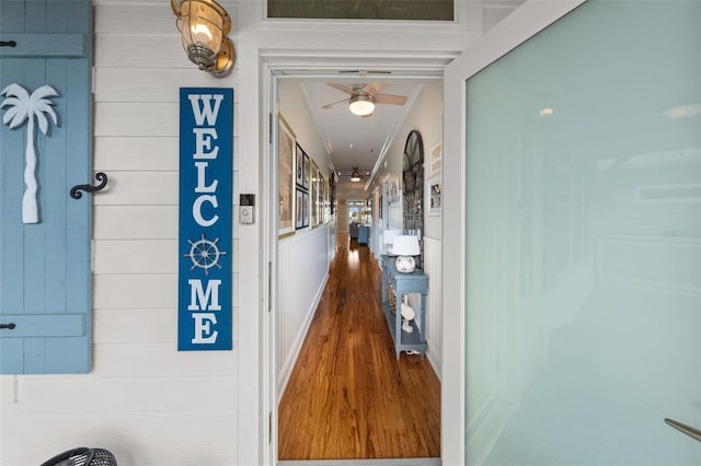 corridor featuring hardwood / wood-style floors