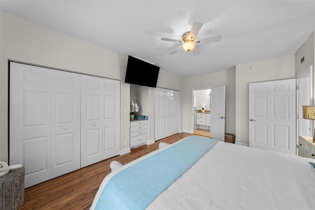 bedroom with wood-type flooring, connected bathroom, and ceiling fan