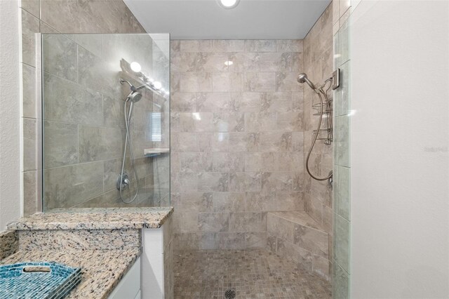 bathroom with a tile shower