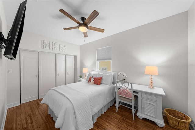 bedroom featuring dark hardwood / wood-style flooring, a closet, and ceiling fan