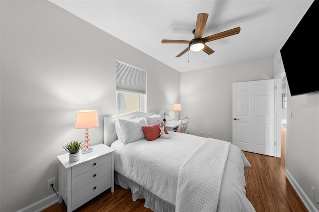 bedroom with dark hardwood / wood-style floors and ceiling fan