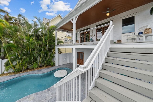 view of pool featuring ceiling fan