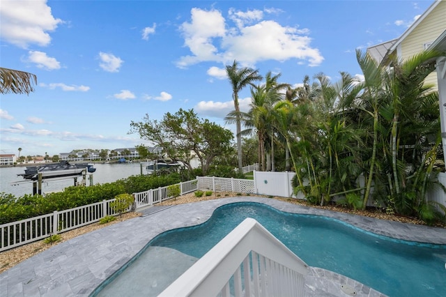 view of pool featuring a water view