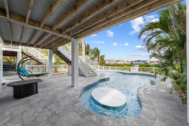 view of swimming pool featuring a patio