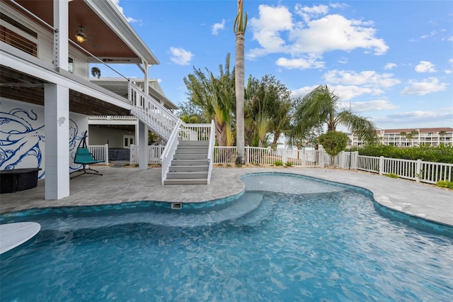 view of pool featuring a patio area and ceiling fan