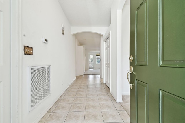 hallway featuring light tile patterned floors