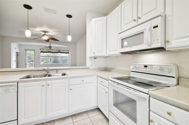 kitchen featuring white cabinetry, sink, and white appliances