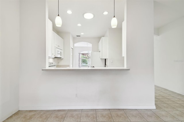 kitchen with kitchen peninsula, white cabinetry, decorative light fixtures, and white appliances