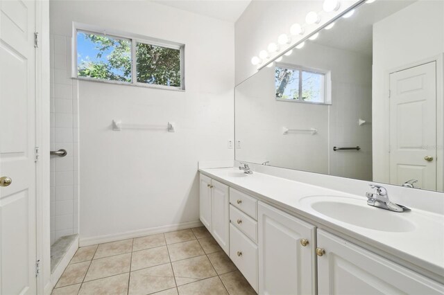 bathroom with tile patterned flooring and vanity