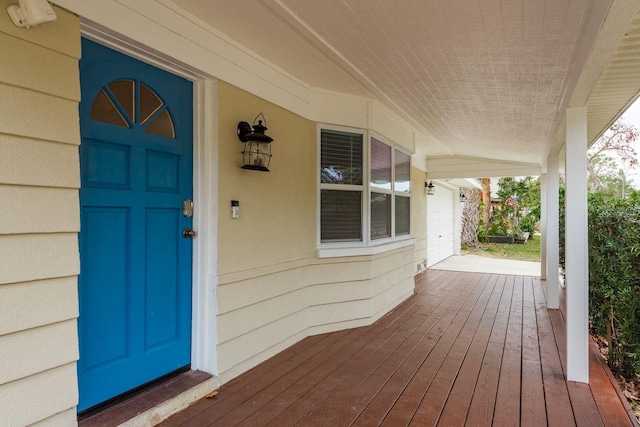 view of exterior entry featuring a porch