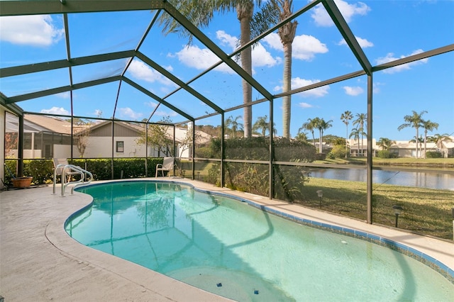 view of swimming pool with a water view, glass enclosure, and a patio area