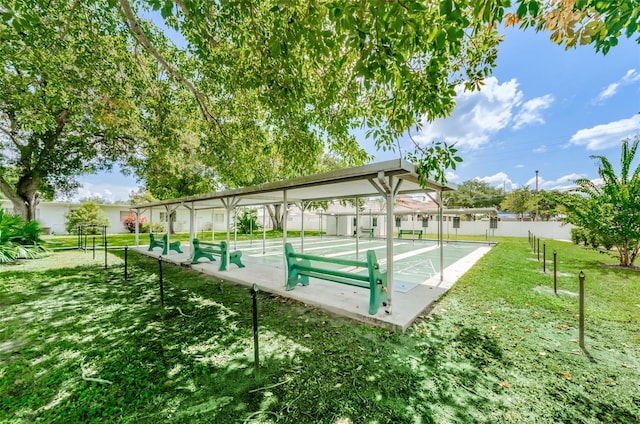 view of swimming pool with a lawn