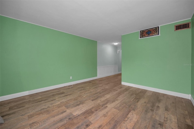 spare room with hardwood / wood-style floors